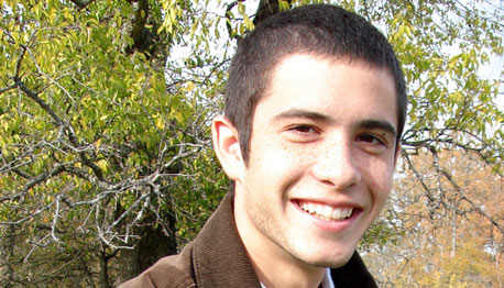 smiling young man outside